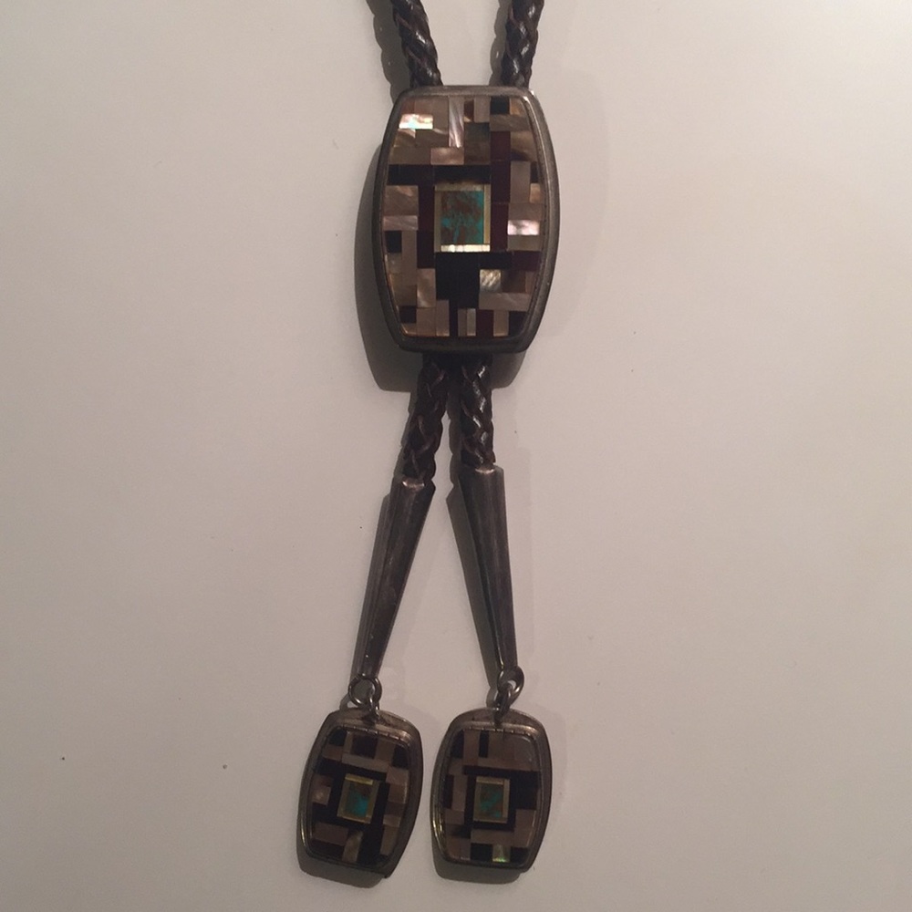 Bolo tie with silver and stone, braided leather